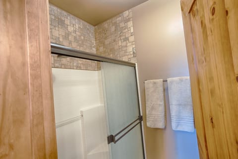 Combined shower/tub, hair dryer, towels, soap