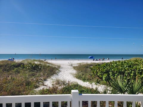 On the beach, sun loungers, beach towels