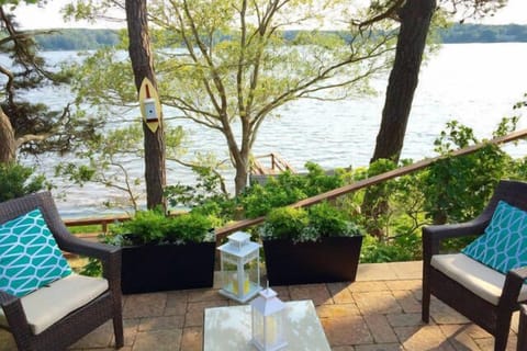 Waterfront on Follins Bay. Sit back on this beautiful stone patio and enjoy!
