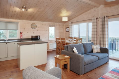 The living/ dinning/ kitchen room in Ben Wyvis Lodge.