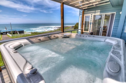 Large hot tub with views on the second floor deck.