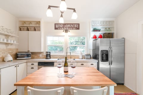 Farmhouse Kitchen | Windows Look Out to Fenced Yard
