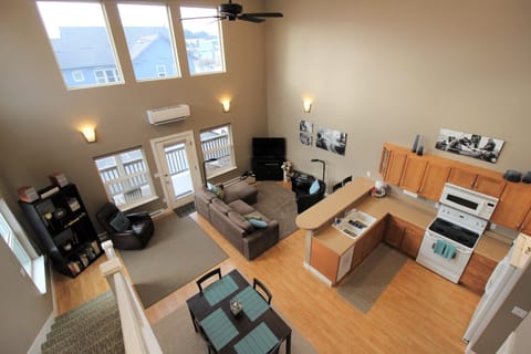 An overhead view of the living room, kitchen and dining area.