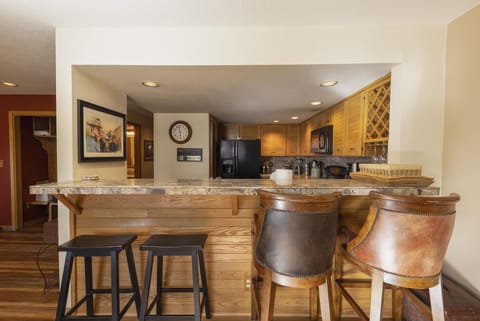Bar area off of full kitchen.