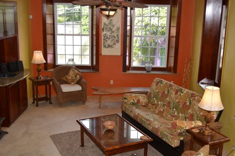 Living Room w/ cherry & granite windows andmahogony doors.