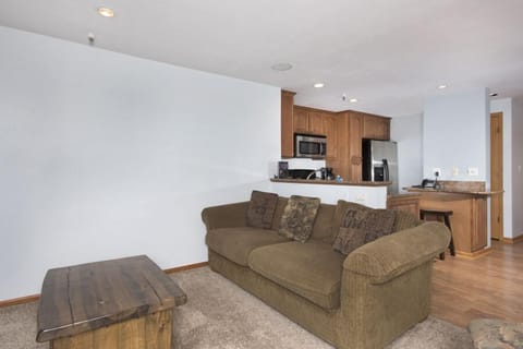 Living room with smart TV and gas fireplace.
