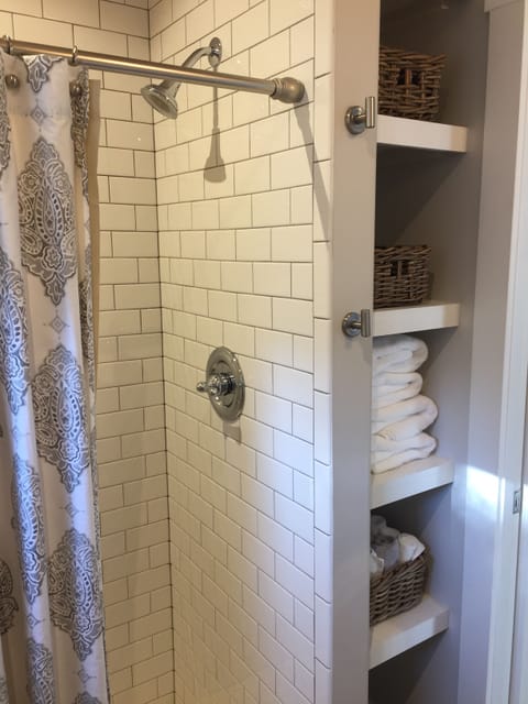 Shower, hair dryer, heated floors, towels
