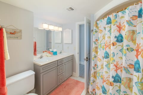 Bathroom with 2 sinks and tub shower