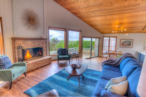 Mid Century Modern decor with a warm wood burning fireplace!