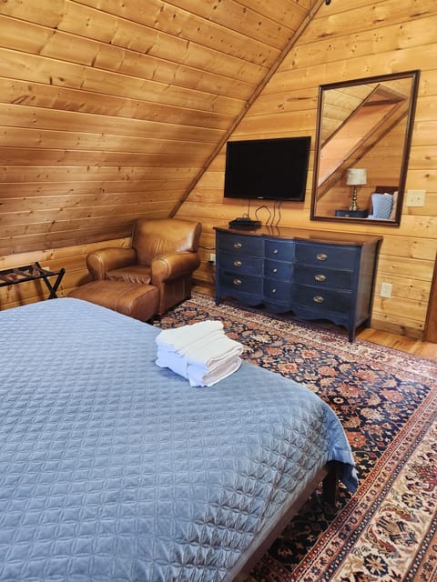 Main bedroom has large screen TV and dresser with plenty of room.