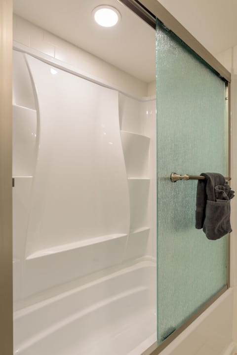 Combined shower/tub, hair dryer, towels, soap