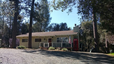 The house is far from the street. Driveway is circular.