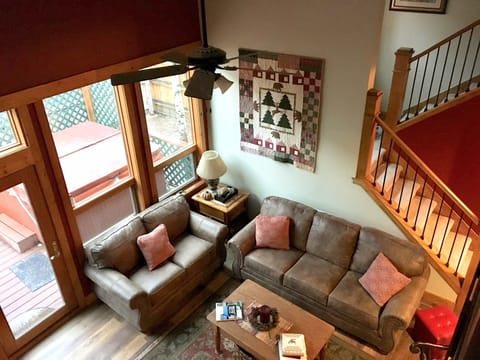 view of main floor living area from 2nd floor railing