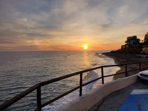 On the beach, sun loungers, beach towels