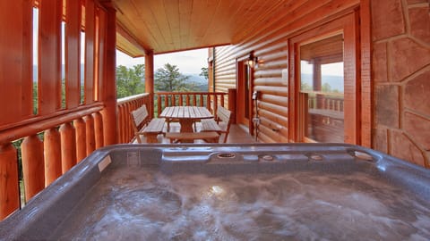 Hot Tub with seating area and mountain views