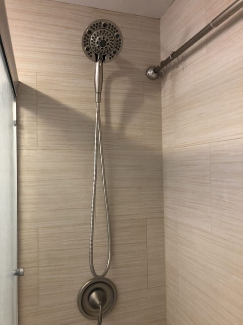 Magnetic removable shower head with 5 settings. Gentle on sunburned skin. 