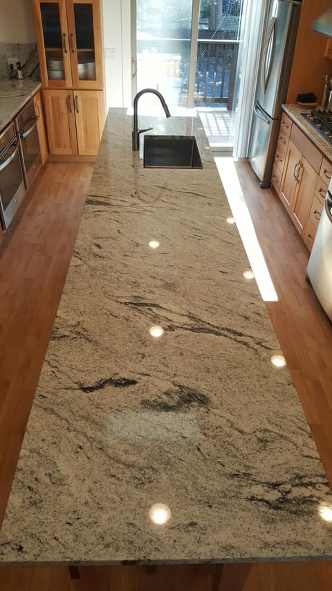 4 Stools under huge kitchen island make for great entertaining.