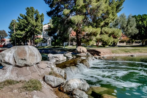Enjoy the community waterfall as you stroll around the lake
