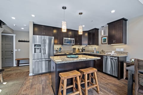 Updated kitchen with stainless appliances and granite countertops