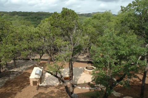 View from deck of patio, PRO BBQ grill, large counter, table and seating for 4.