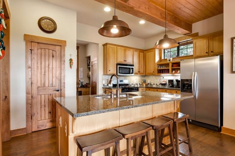 Large double door refrigerator with ice maker, Keurig coffee maker, blender.