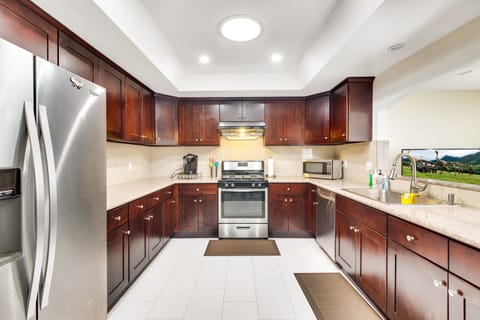 Large kitchen area with newer appliances and furnishings