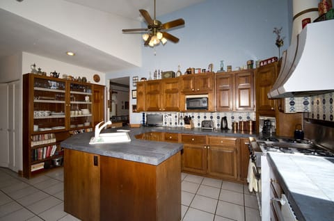 In floor heating on main level.  Exit to rear patio and hot tub from kitchen 