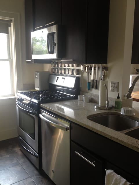 Kitchen with dishwasher, microwave, coffee maker