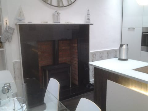 Kitchen (table, island and wood burning stove)
