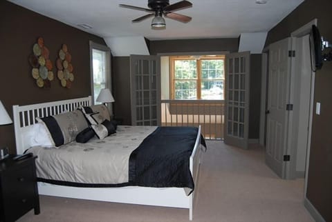 Master Bedroom #1 features a balcony with lake views, jetted tub and lg bath