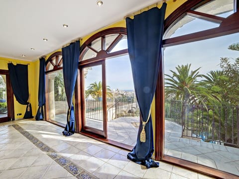 Property, Building, Azure, Shade, Architecture, Interior Design, Paint, Yellow, Floor, Sky