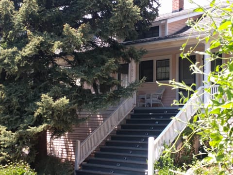 Great covered porch, with swing to relax and read a book! Honeysuckle=Hummers