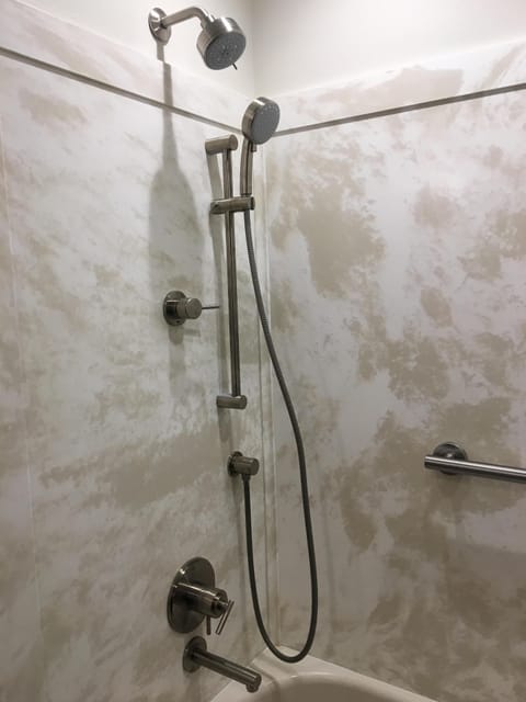 Combined shower/tub, hair dryer, towels, soap