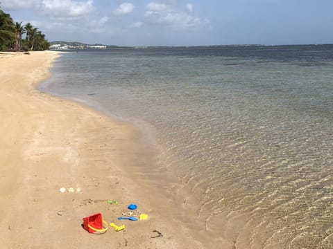 On the beach, sun loungers, beach towels