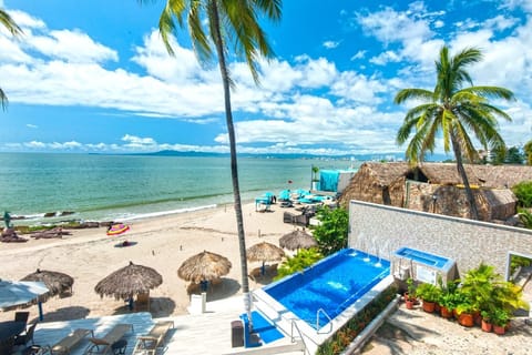 On the beach, sun loungers, beach towels