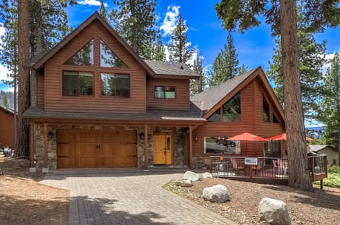 Your summer haven awaits with a picturesque cabin surrounded by lofty
pines