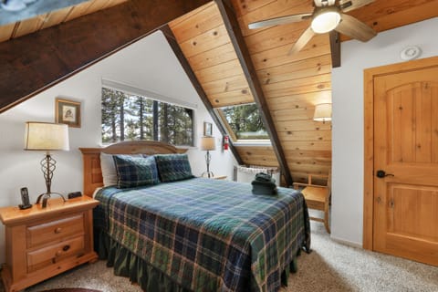 Room with a view, queen bed and panoramic windows bring Tahoe beauty inside. 