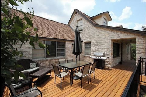 Spacious deck with ample seating, propane grill, string lights and misters!