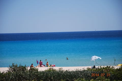 On the beach, sun loungers, beach towels