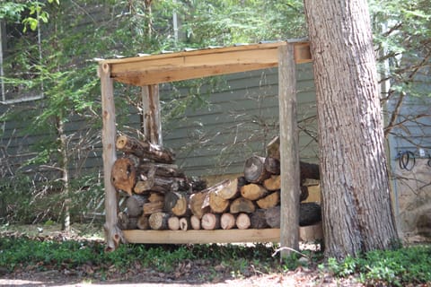 There is wood for the fireplace right outside
