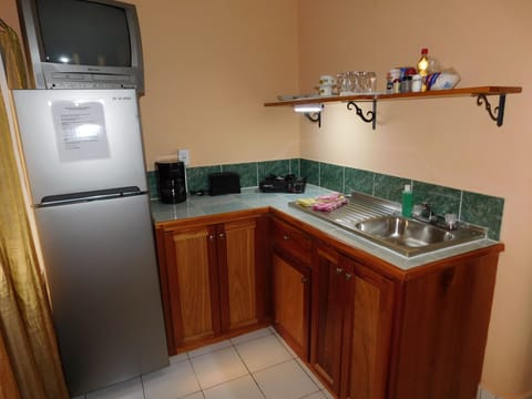 Fridge, microwave, stovetop, coffee/tea maker