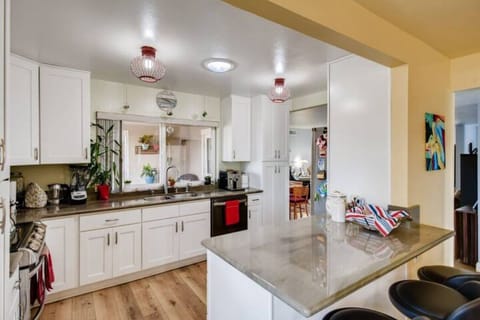The kitchen is light and full of easy to use appliances.