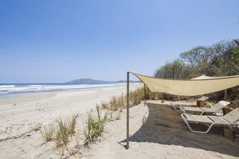 On the beach, sun loungers, beach towels