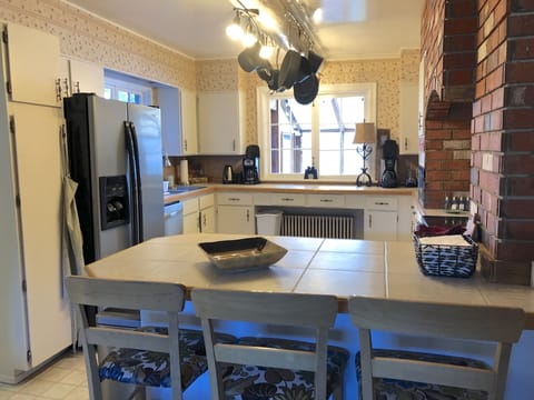 The kitchen has room for multiple cooks.  Views to the solarium, bay and hot 