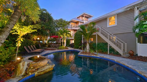 A heated pool, a waterfall pool, pool umbrellas