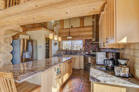 Full size refrigerator, pantry, 6 burner stove, double oven, microwave.