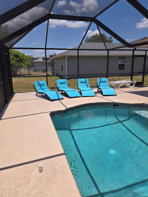 A heated pool, sun loungers