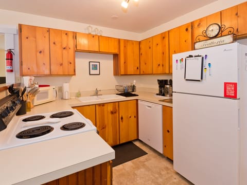 Kitchen with Dish Washer, Stove and Refrigerator