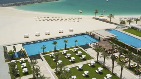 "View of Al Bateen pool area and beach to the right from lower floor
