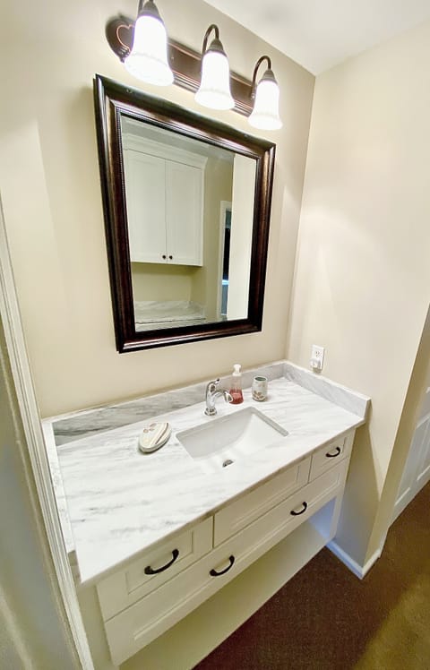 Buddy Bath connecting Master to Kids room . (extra vanity in hall)